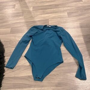 Woman’s blue long sleeve bodysuit size large